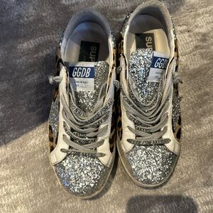 Golden goose silver glitter and pony hide hair.  Size 36